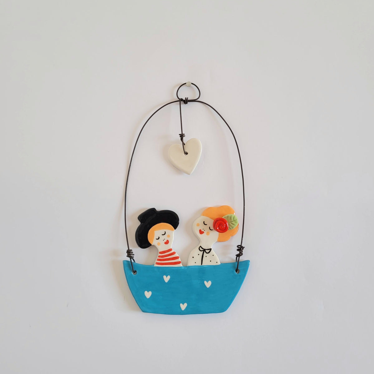 Ceramic wall hanging "Happy couple in a blue boat"