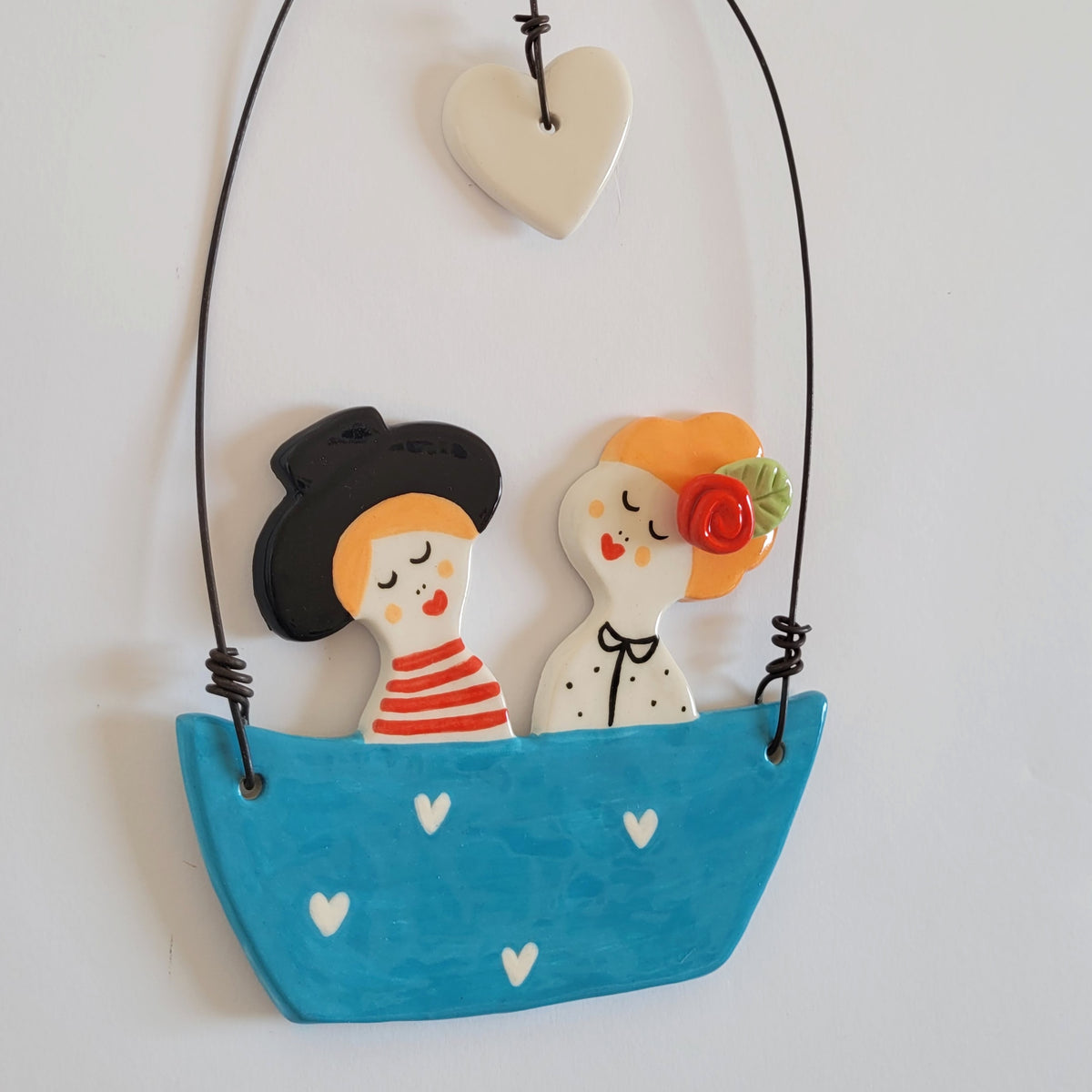 Ceramic wall hanging "Happy couple in a blue boat"