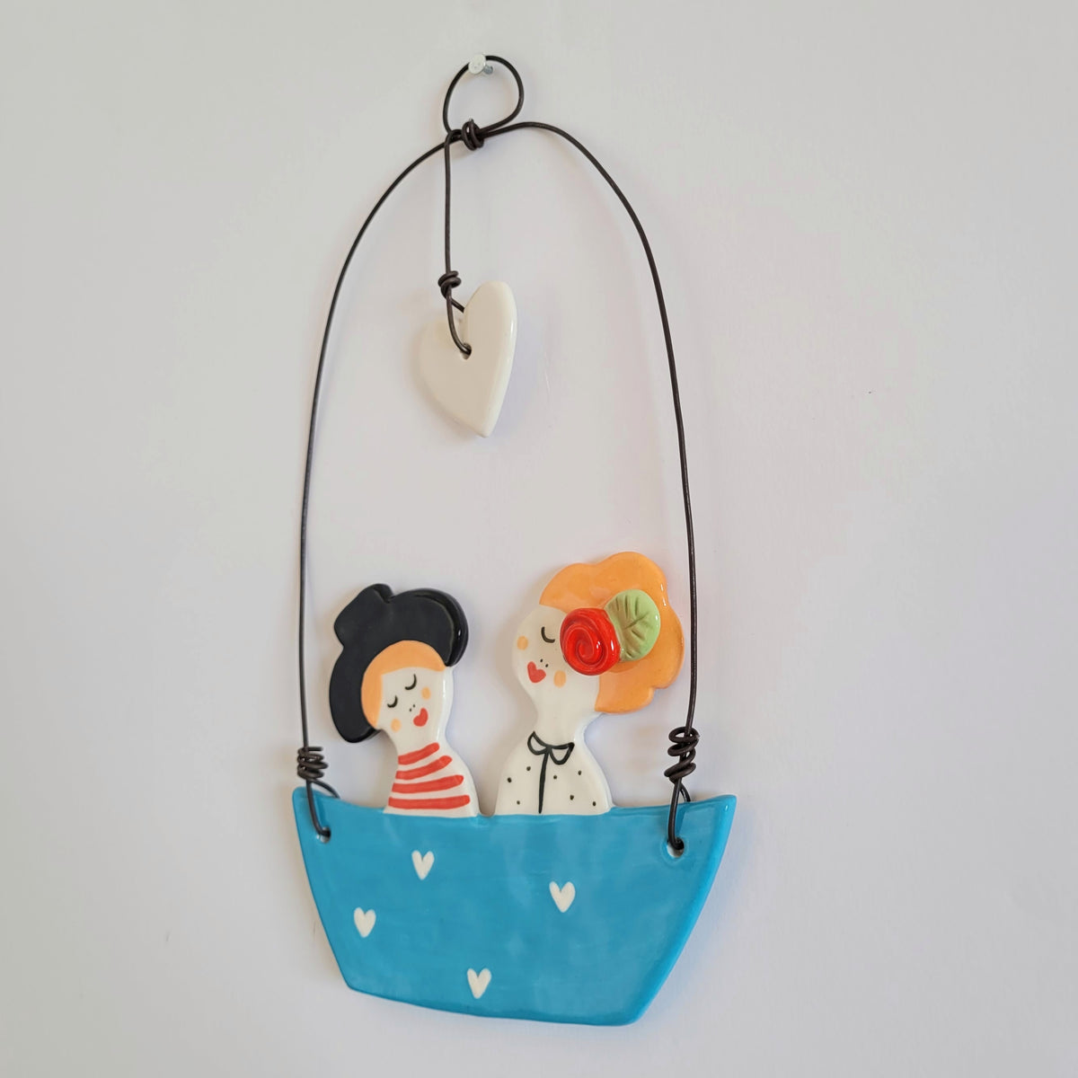 Ceramic wall hanging "Happy couple in a blue boat"