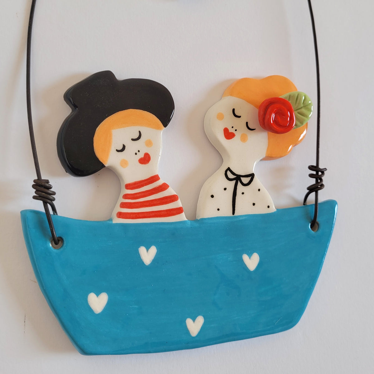 Ceramic wall hanging "Happy couple in a blue boat"